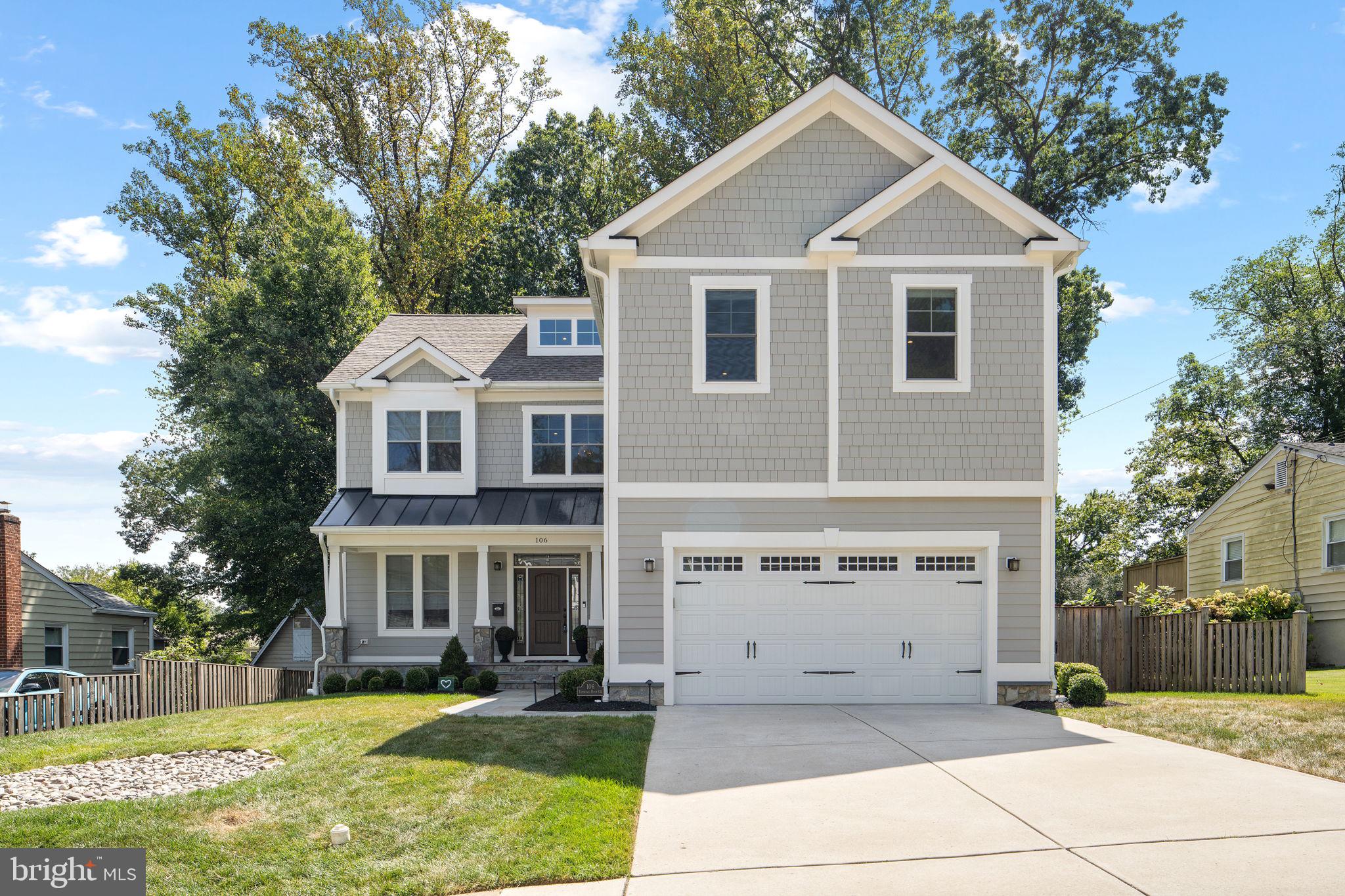 106 Tapawingo Road Southwest Vienna, VA 22180 - Photo 2 of 91 a front view of a house with a yard and garage