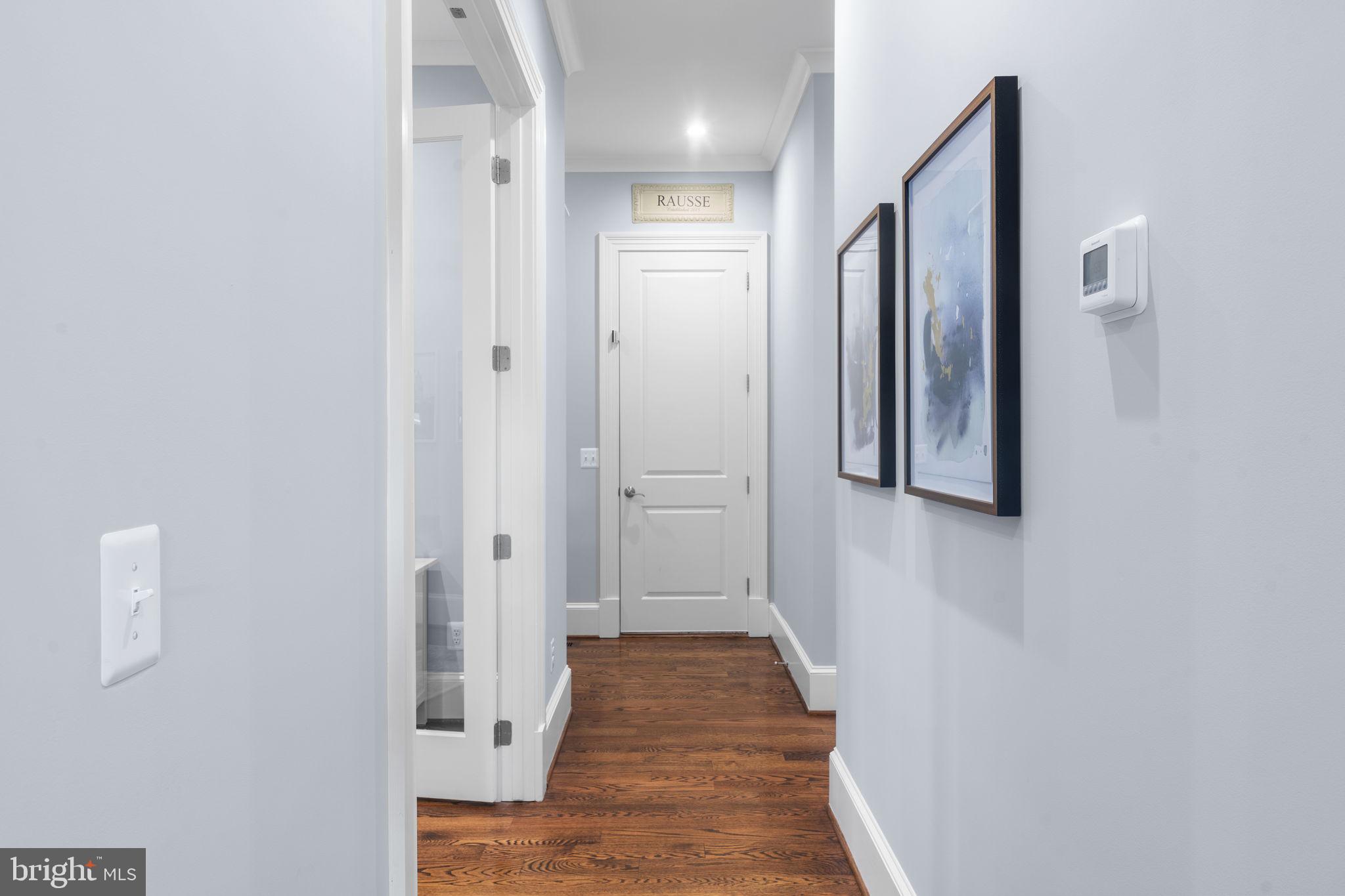 106 Tapawingo Road Southwest Vienna, VA 22180 - Photo 23 of 91 a view of a hallway with wooden floor and a bathroom