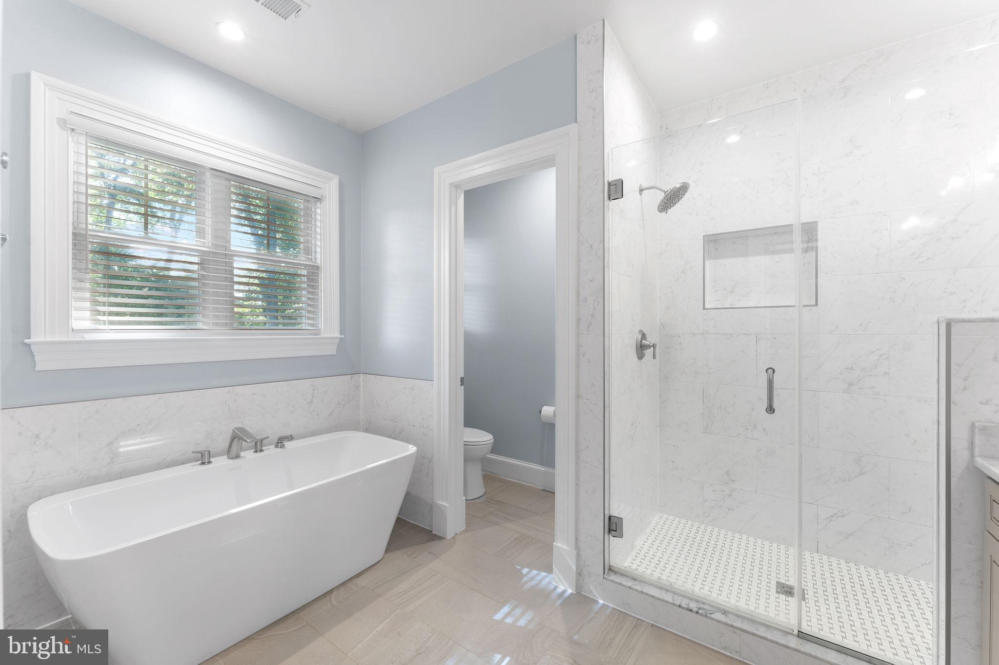 106 Tapawingo Road Southwest Vienna, VA 22180 - Photo 31 of 91 a bathroom with a bathtub and a shower