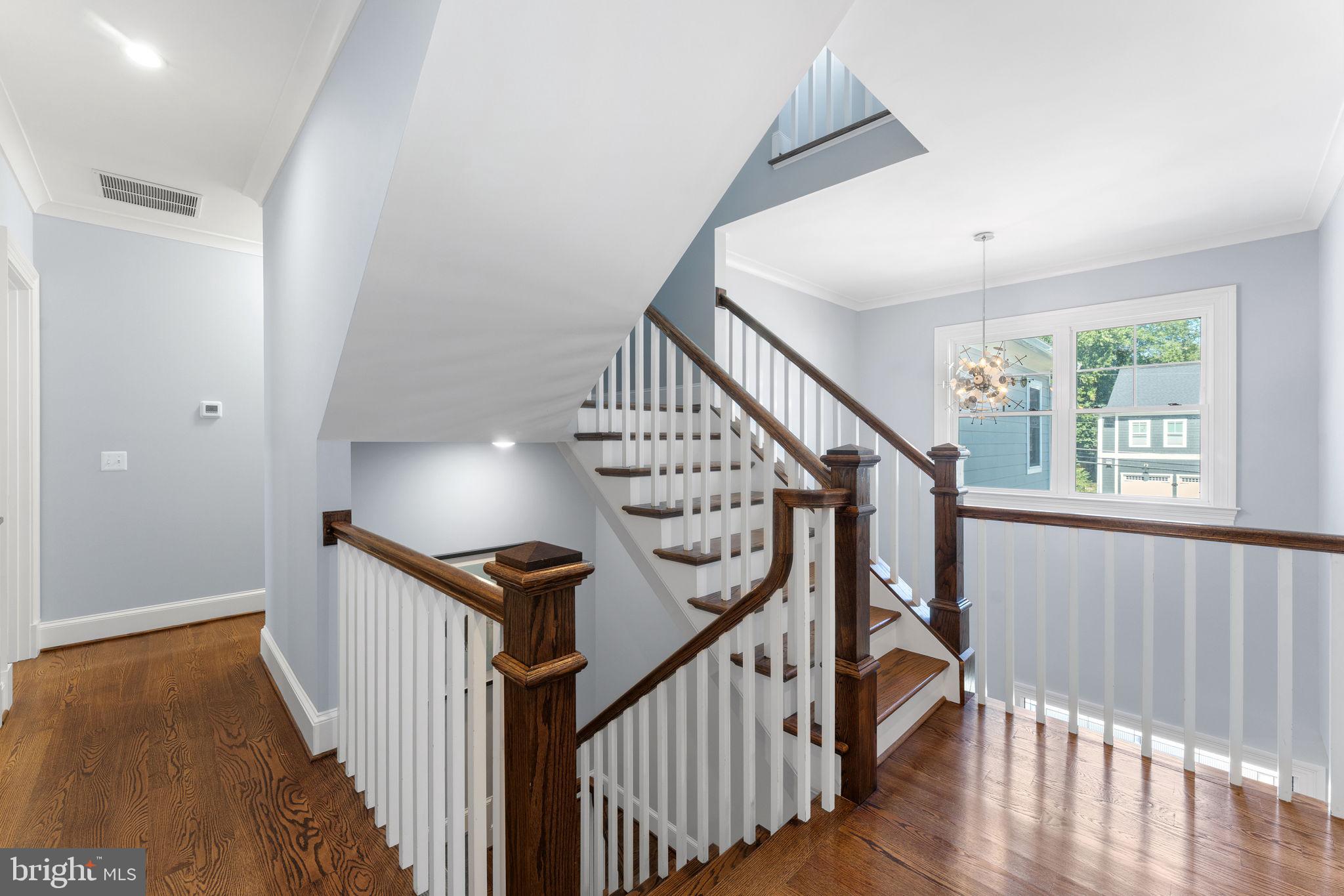 106 Tapawingo Road Southwest Vienna, VA 22180 - Photo 50 of 91 a view of staircase with wooden floor and white walls