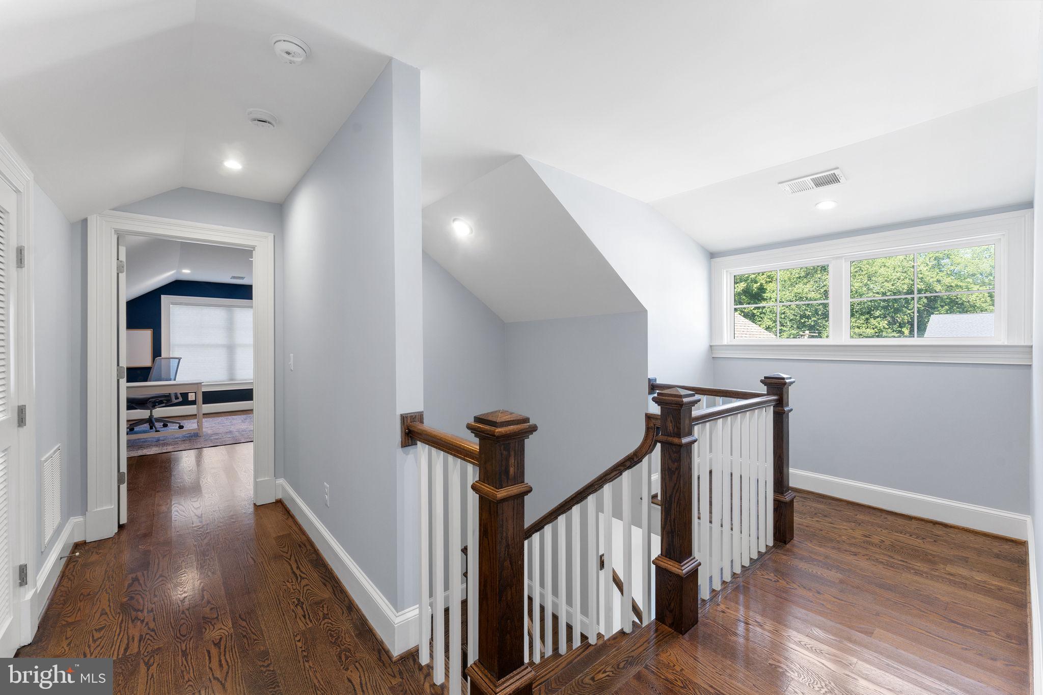106 Tapawingo Road Southwest Vienna, VA 22180 - Photo 53 of 91 a view of a hallway with wooden floor and staircase