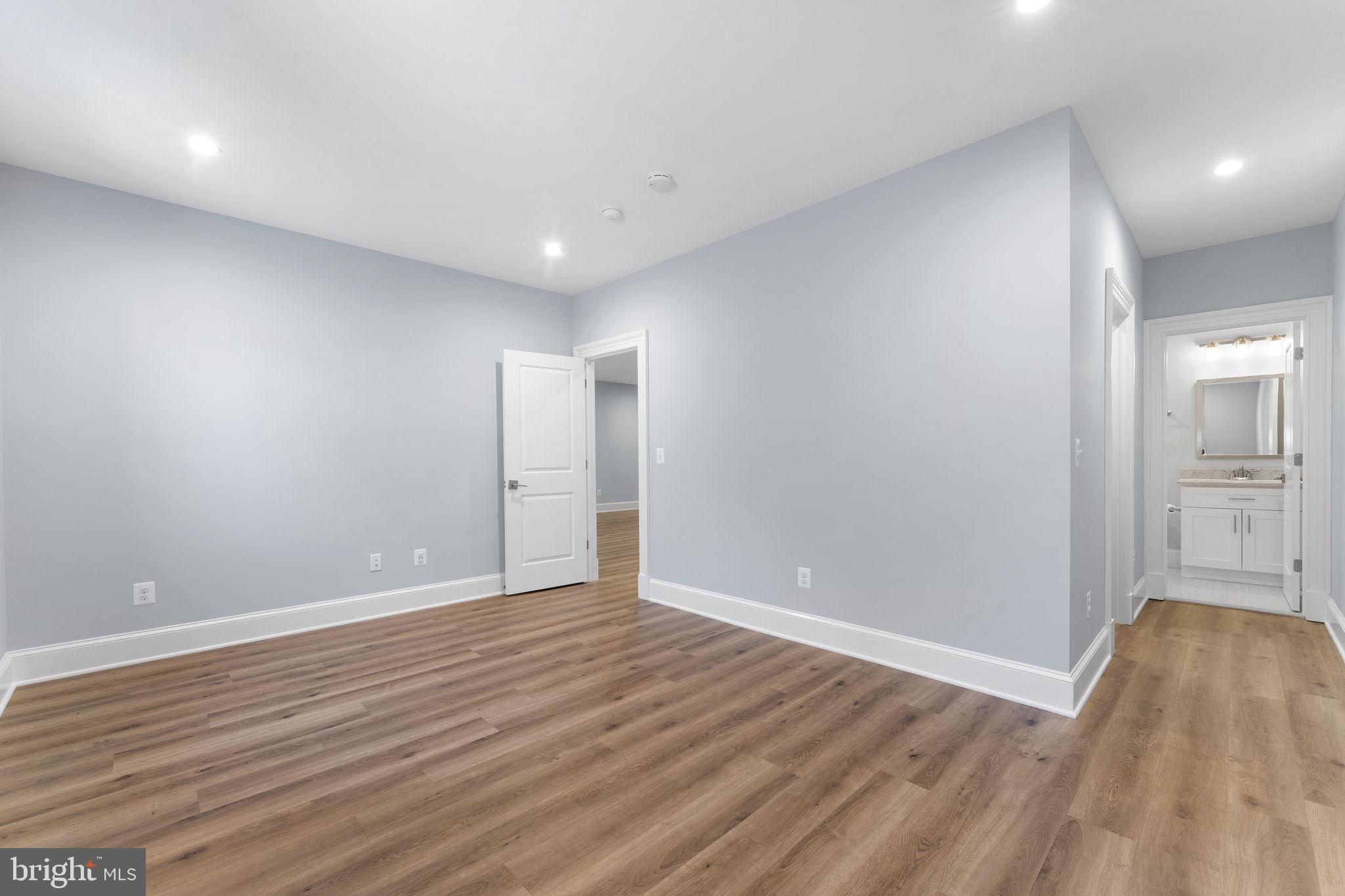 106 Tapawingo Road Southwest Vienna, VA 22180 - Photo 57 of 91 a view of wooden floor and windows in a room