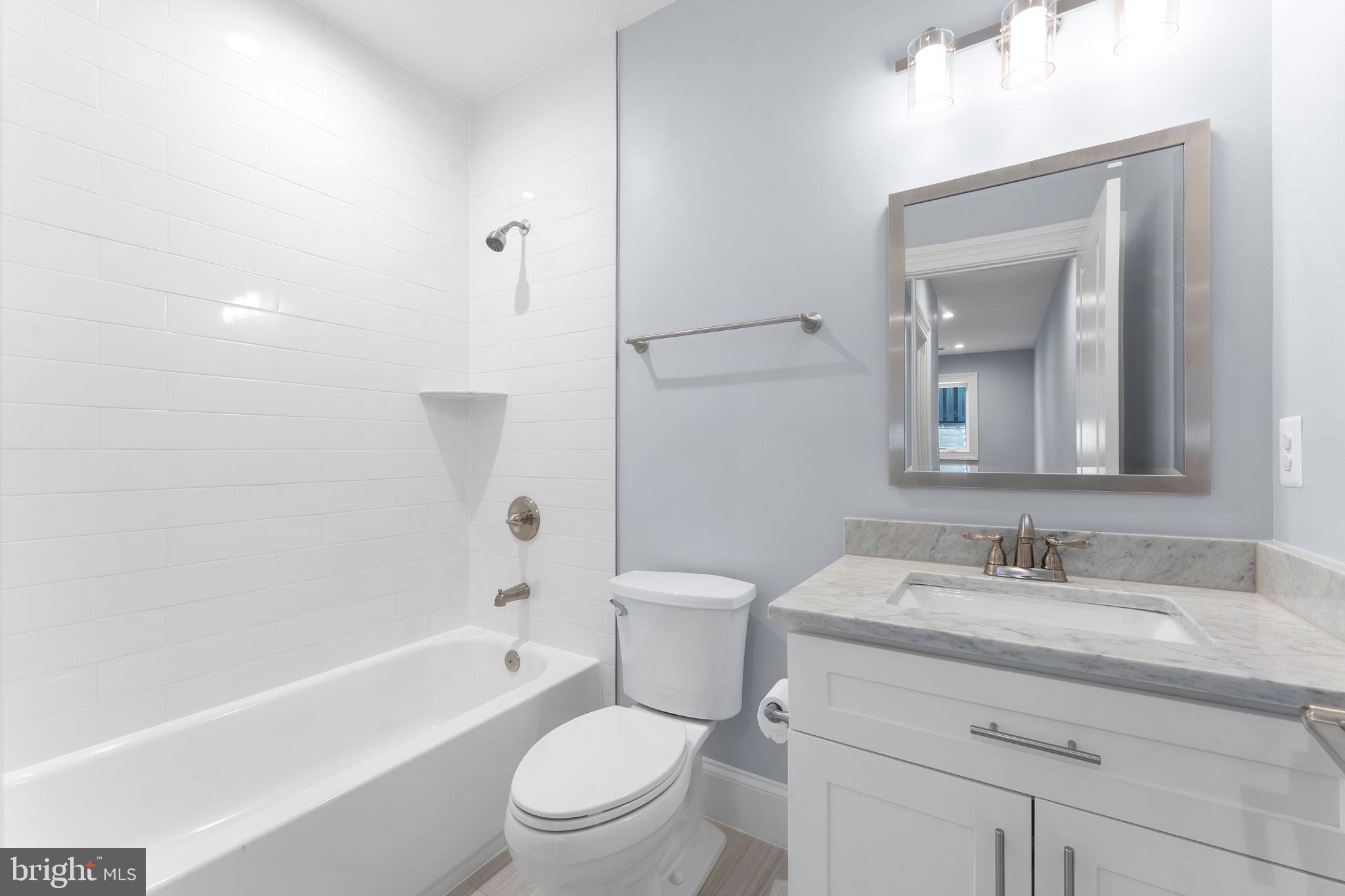 106 Tapawingo Road Southwest Vienna, VA 22180 - Photo 58 of 91 a bathroom with a sink toilet and shower