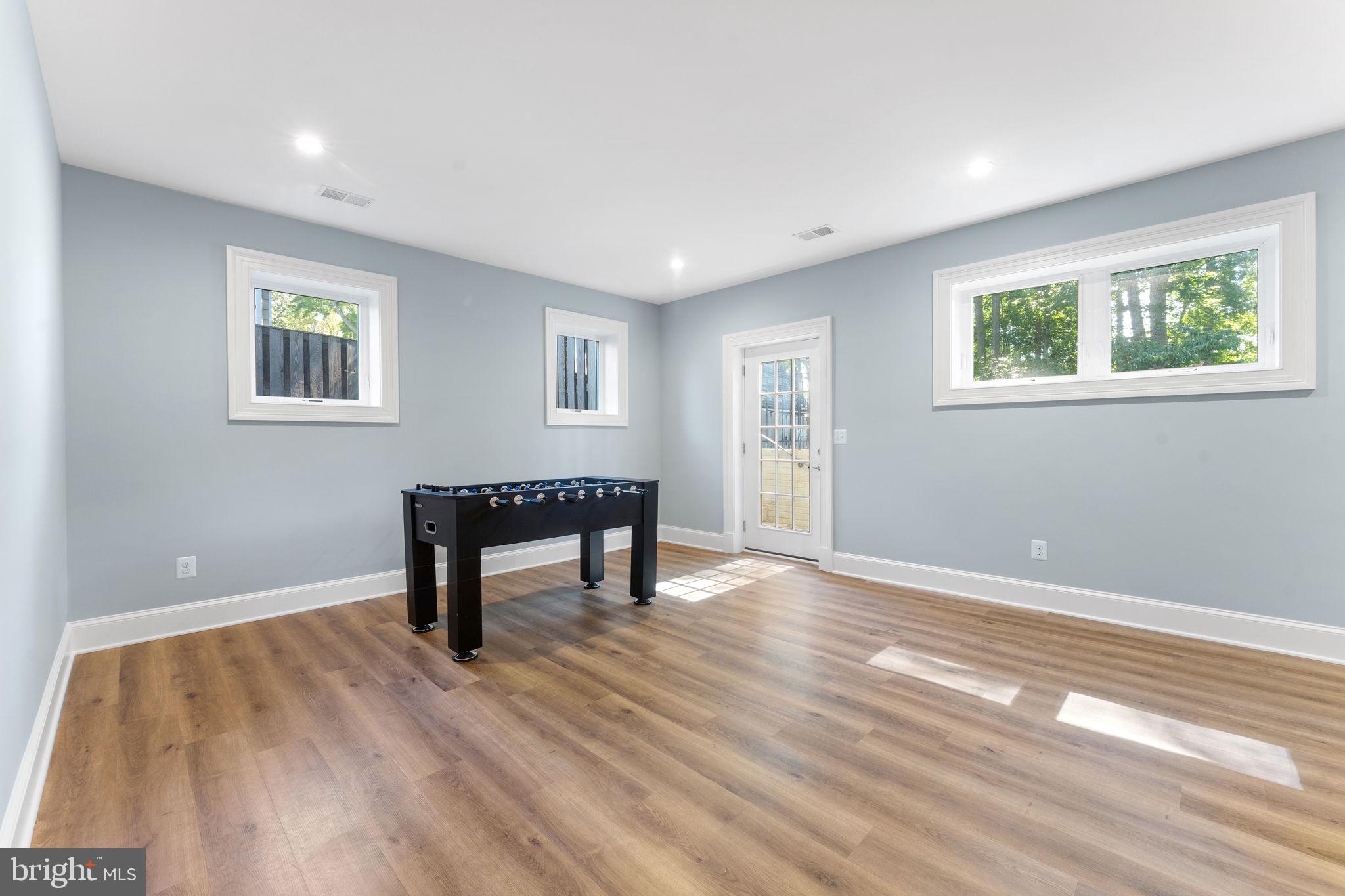 106 Tapawingo Road Southwest Vienna, VA 22180 - Photo 59 of 91 a view of an empty room with a window and wooden floor