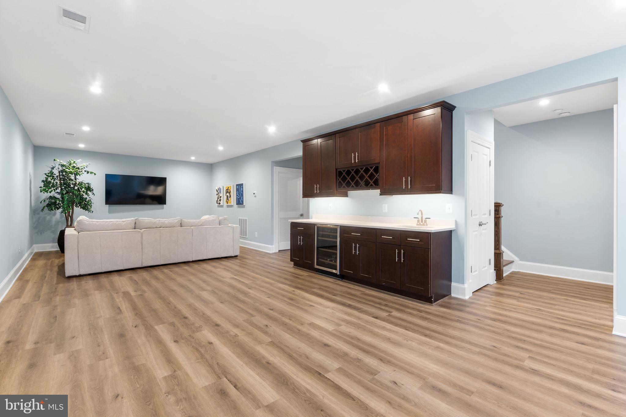 106 Tapawingo Road Southwest Vienna, VA 22180 - Photo 60 of 91 a living room with furniture and a flat screen tv