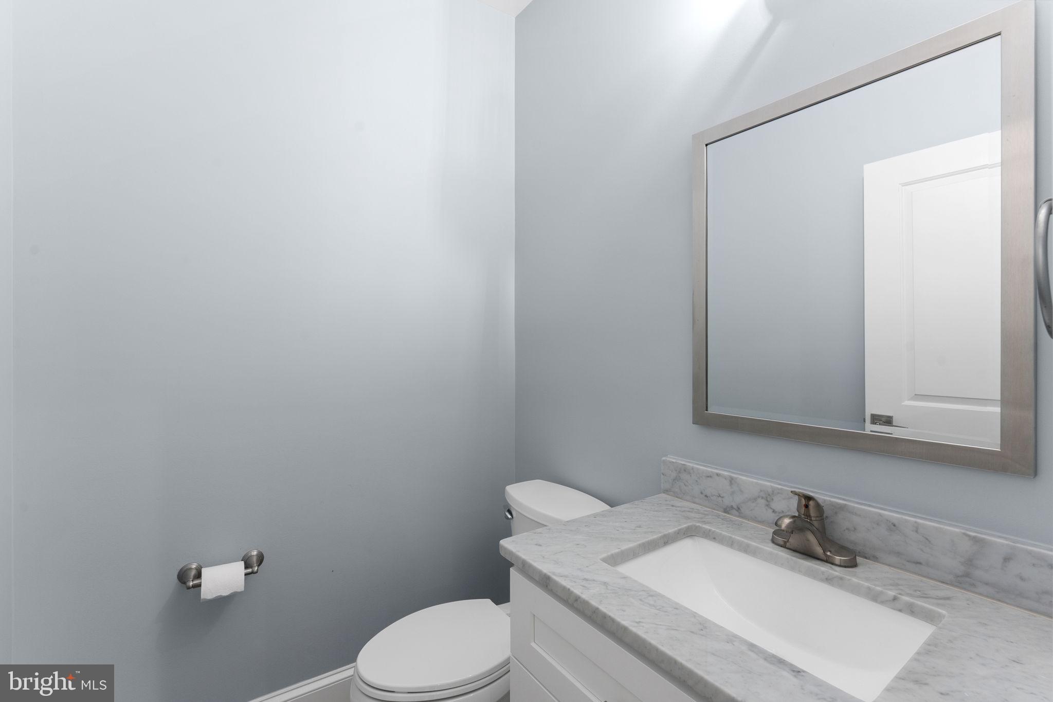 106 Tapawingo Road Southwest Vienna, VA 22180 - Photo 63 of 91 a bathroom with a sink toilet and mirror