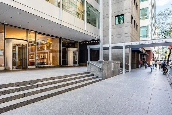 a view of a building with car parked