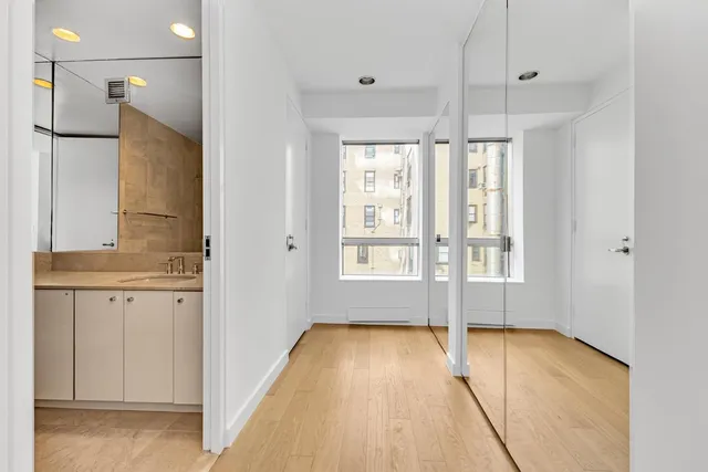 a view of an empty room with glass door