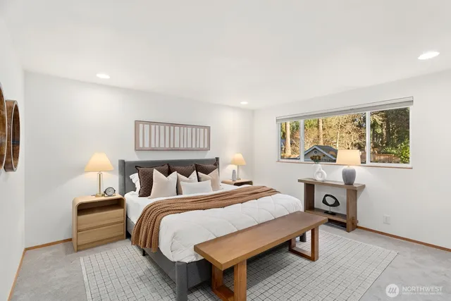 a bed room with a bed and a table