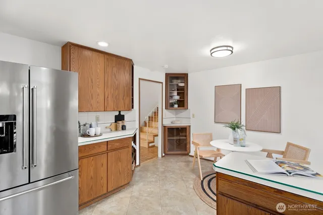 a kitchen with a sink appliances and cabinets