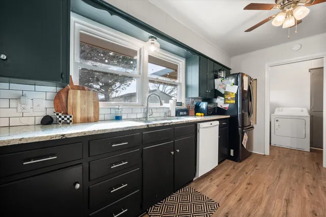 a kitchen with a sink stove and refrigerator