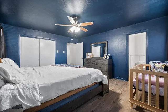 a bathroom with a granite countertop sink a mirror and a shower