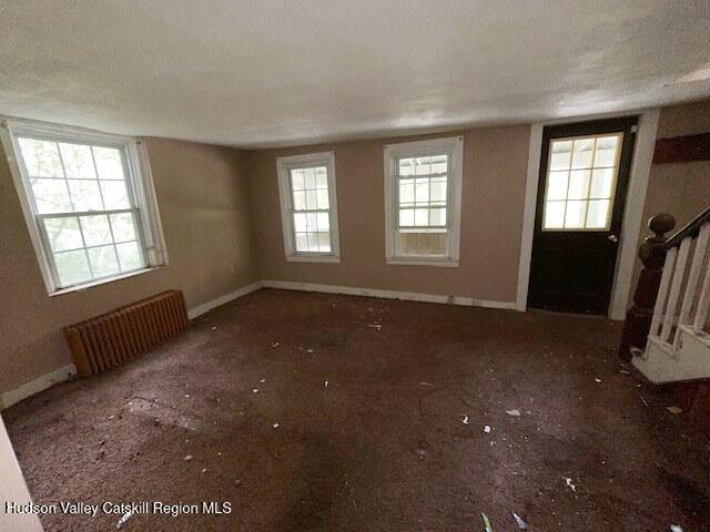 818 Cauterskill Road Catskill, NY 12414 - Photo 4 of 17 a view of an empty room with glass door
