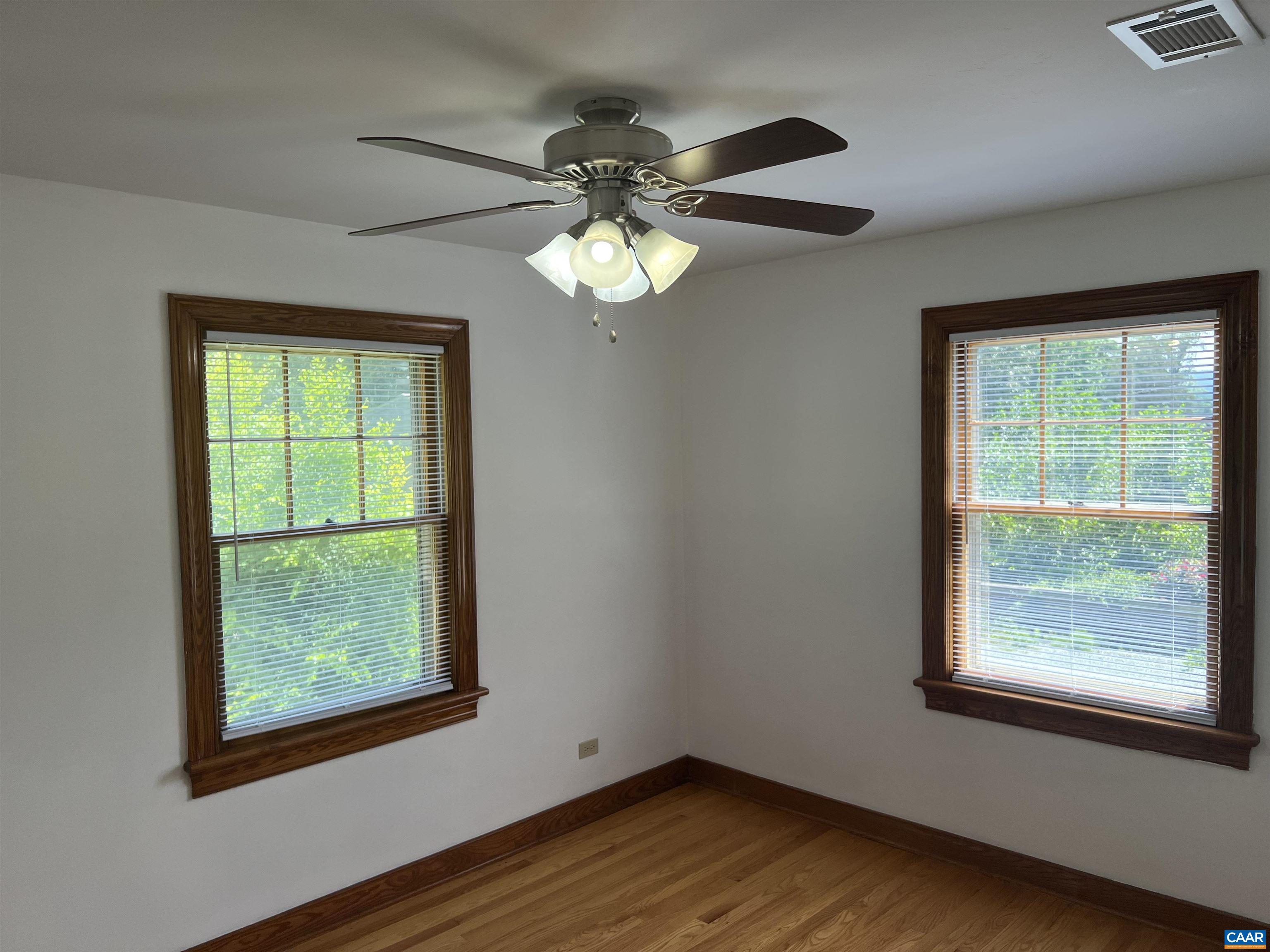 1320 Avon Street Charlottesville, VA 22902 - Photo 16 of 40 a view of an empty room with wooden floor and a window