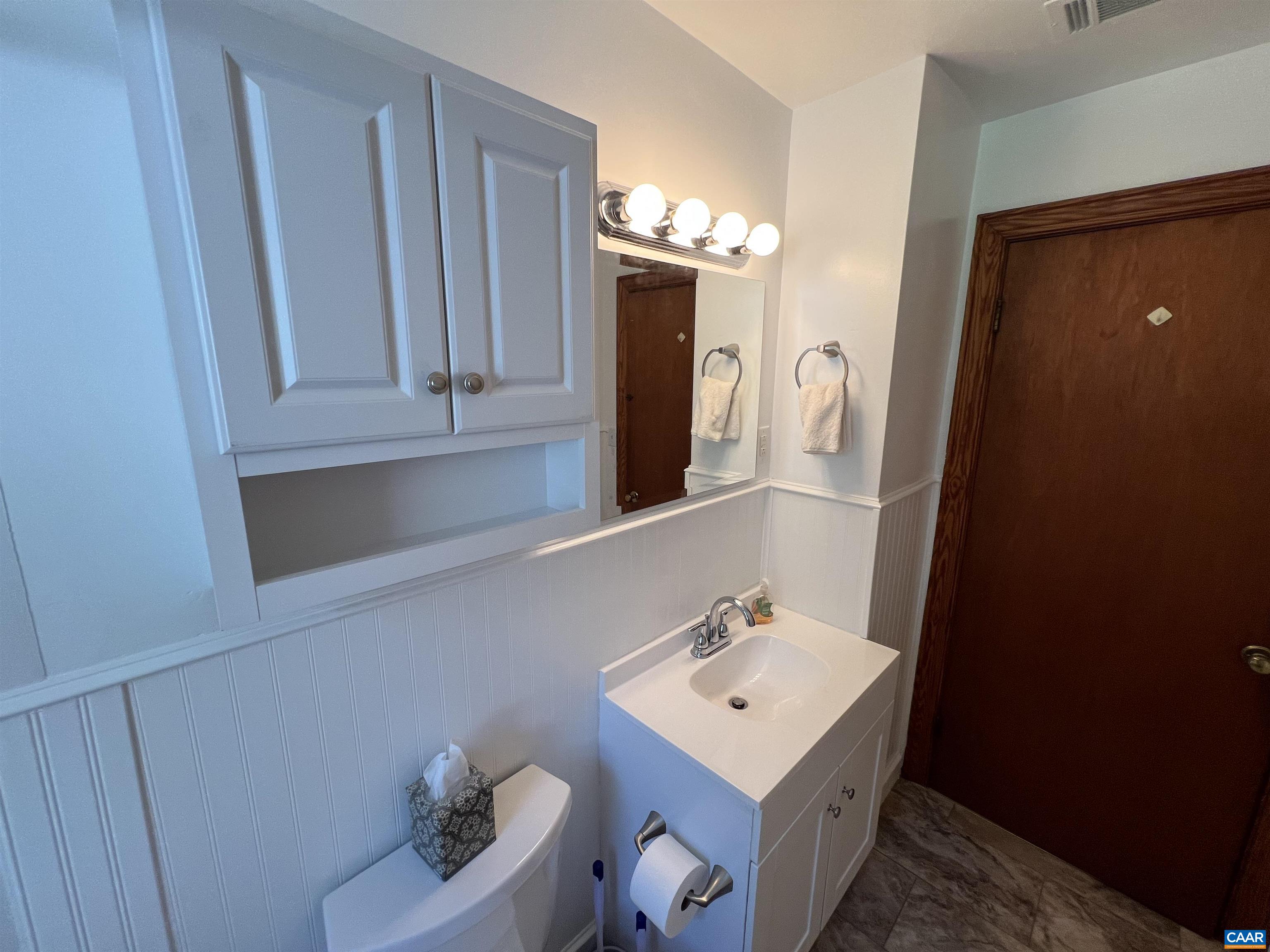 1320 Avon Street Charlottesville, VA 22902 - Photo 18 of 40 a bathroom with a sink vanity and mirror