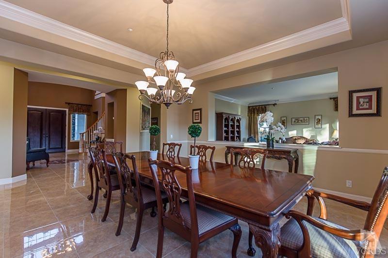 12366 Nelson Road Moorpark, CA 93021 - Photo 12 of 67 a view of a dining room with furniture and chandelier