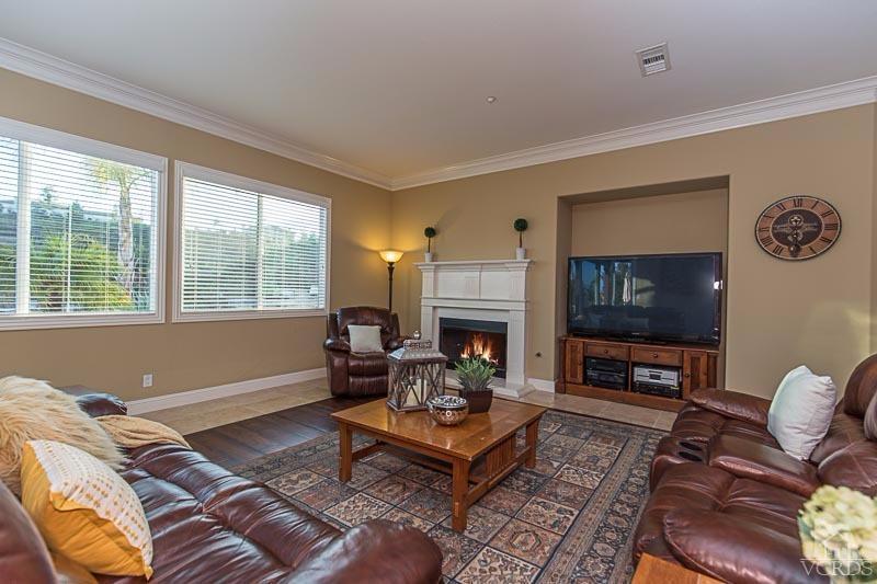 12366 Nelson Road Moorpark, CA 93021 - Photo 14 of 67 a living room with furniture a flat screen tv and a fireplace