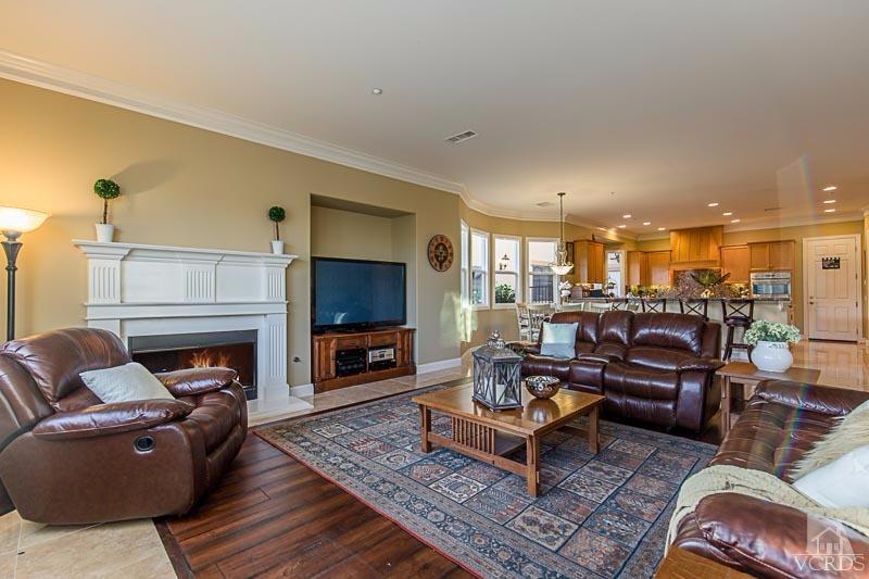 12366 Nelson Road Moorpark, CA 93021 - Photo 15 of 67 a living room with furniture a fireplace and a flat screen tv