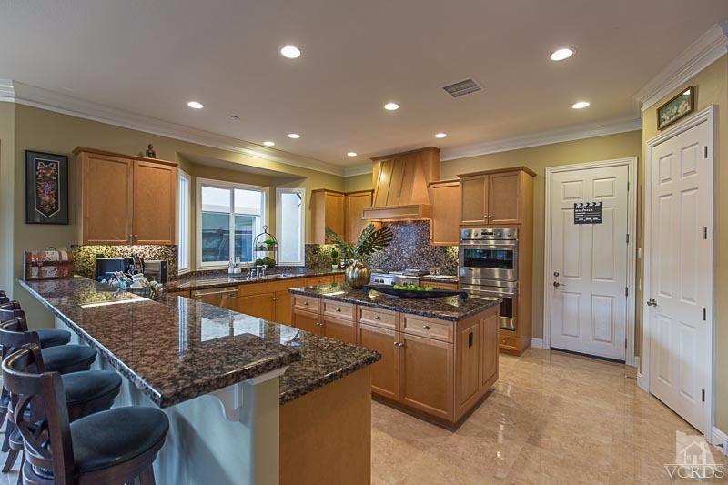 12366 Nelson Road Moorpark, CA 93021 - Photo 20 of 67 a kitchen with stainless steel appliances granite countertop sink stove and refrigerator