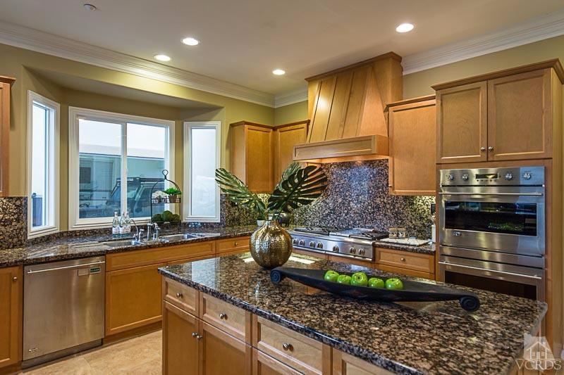 12366 Nelson Road Moorpark, CA 93021 - Photo 21 of 67 a kitchen with kitchen island granite countertop a sink and a stove