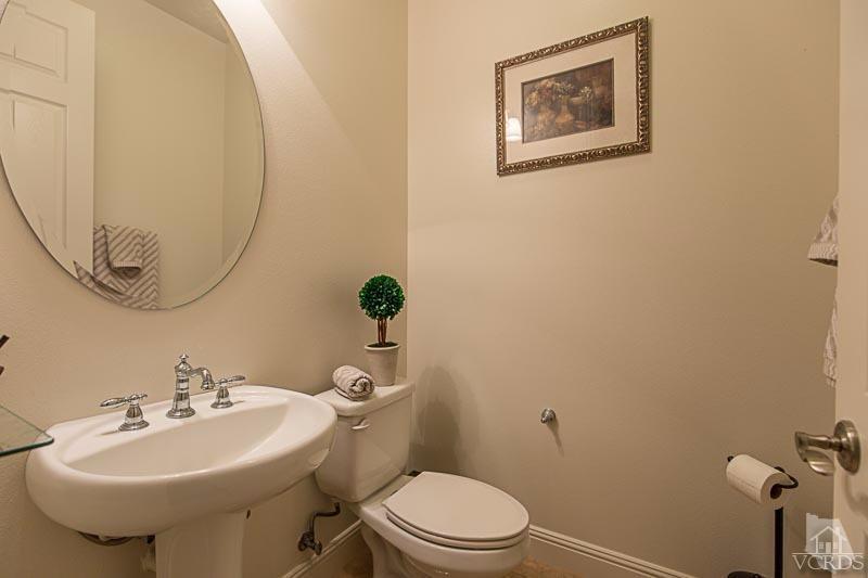 12366 Nelson Road Moorpark, CA 93021 - Photo 28 of 67 a bathroom with a sink mirror and toilet