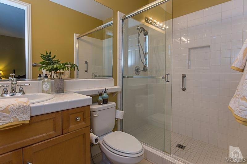 12366 Nelson Road Moorpark, CA 93021 - Photo 30 of 67 a bathroom with a sink a toilet and shower