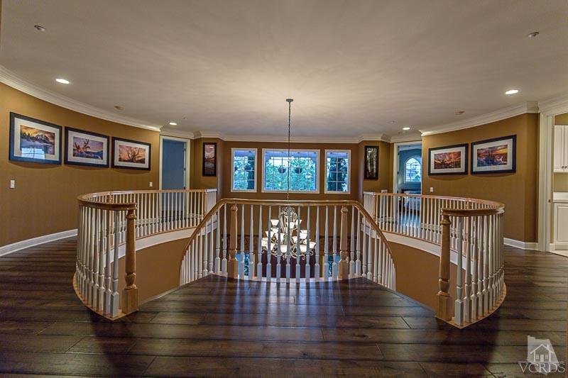 12366 Nelson Road Moorpark, CA 93021 - Photo 31 of 67 a view of a hallway with wooden floor and windows