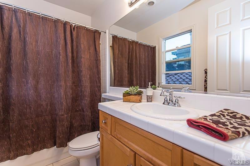 12366 Nelson Road Moorpark, CA 93021 - Photo 41 of 67 a bathroom with a sink a toilet and shower