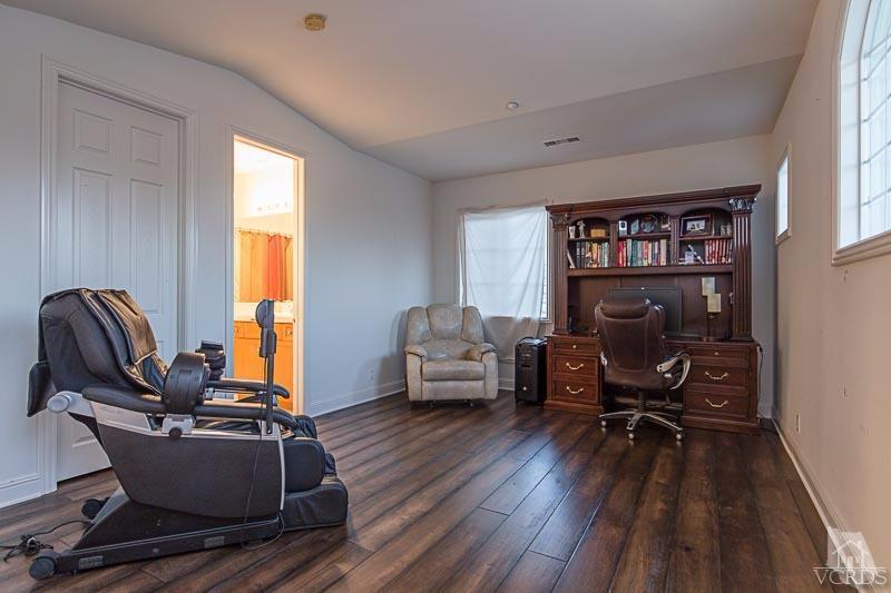 12366 Nelson Road Moorpark, CA 93021 - Photo 42 of 67 a living room with furniture gym equipment and a window