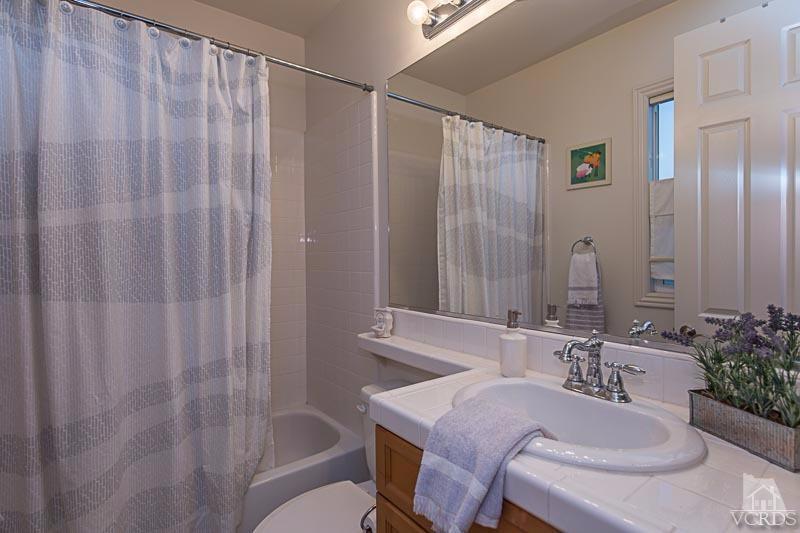 12366 Nelson Road Moorpark, CA 93021 - Photo 47 of 67 a bathroom with a sink and a mirror