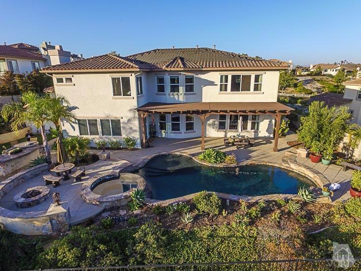 12366 Nelson Road Moorpark, CA 93021 - Photo 48 of 67 a front view of a house with swimming pool and a yard
