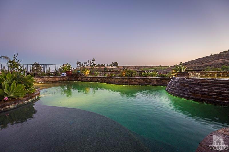 12366 Nelson Road Moorpark, CA 93021 - Photo 54 of 67 a view of a lake with houses in the back
