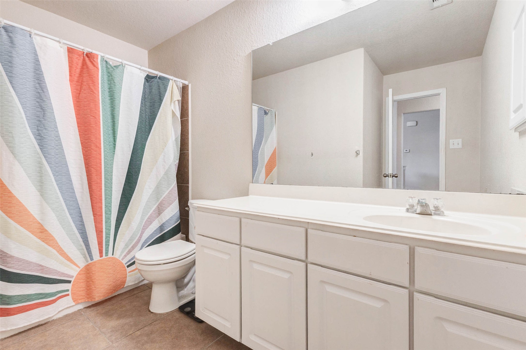 3027 Upland Spring Trace Katy, TX 77493 - Photo 23 of 29 a bathroom with a sink a toilet and a large mirror