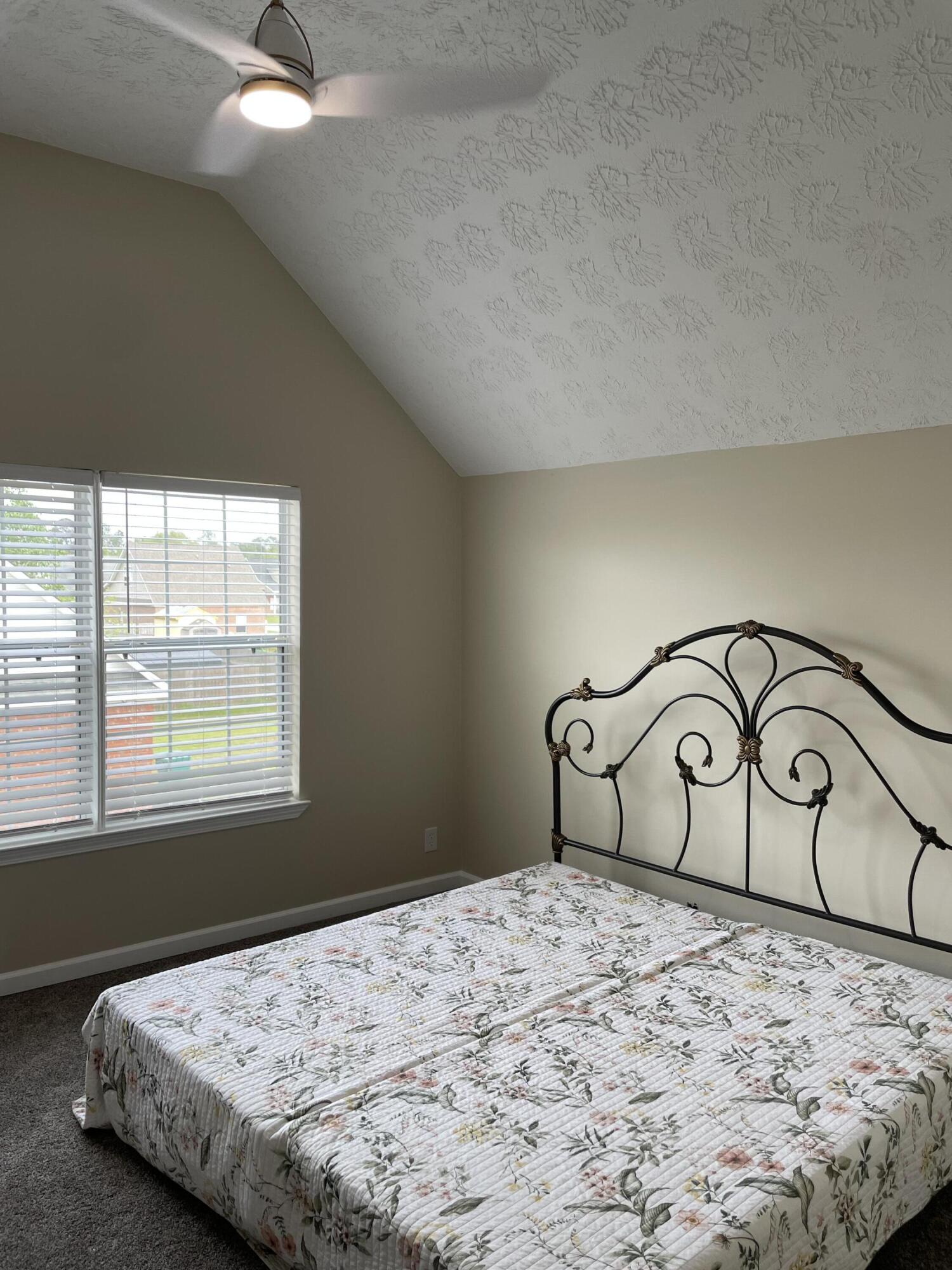 61 Mallot Beach Drive Freeport, FL 32439 - Photo 13 of 19 a bedroom with a bed and a large window