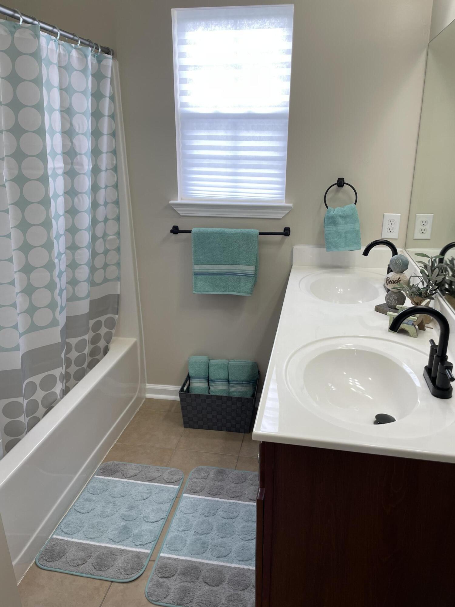 61 Mallot Beach Drive Freeport, FL 32439 - Photo 14 of 19 a bathroom with a sink and a window