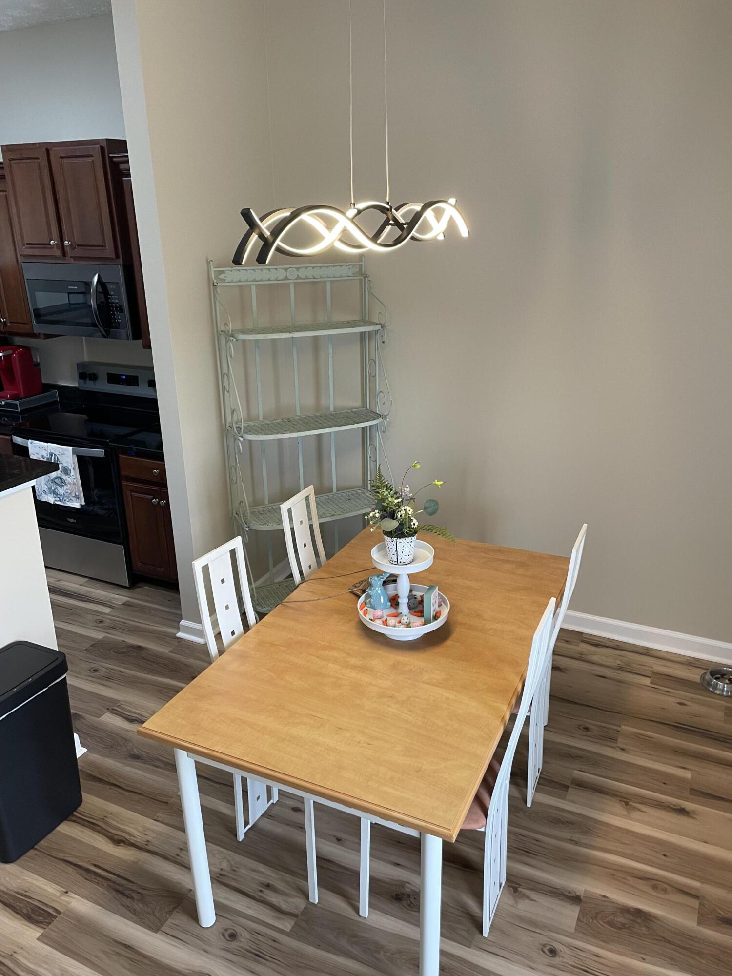 61 Mallot Beach Drive Freeport, FL 32439 - Photo 16 of 19 a view of a dining room with furniture and wooden floor