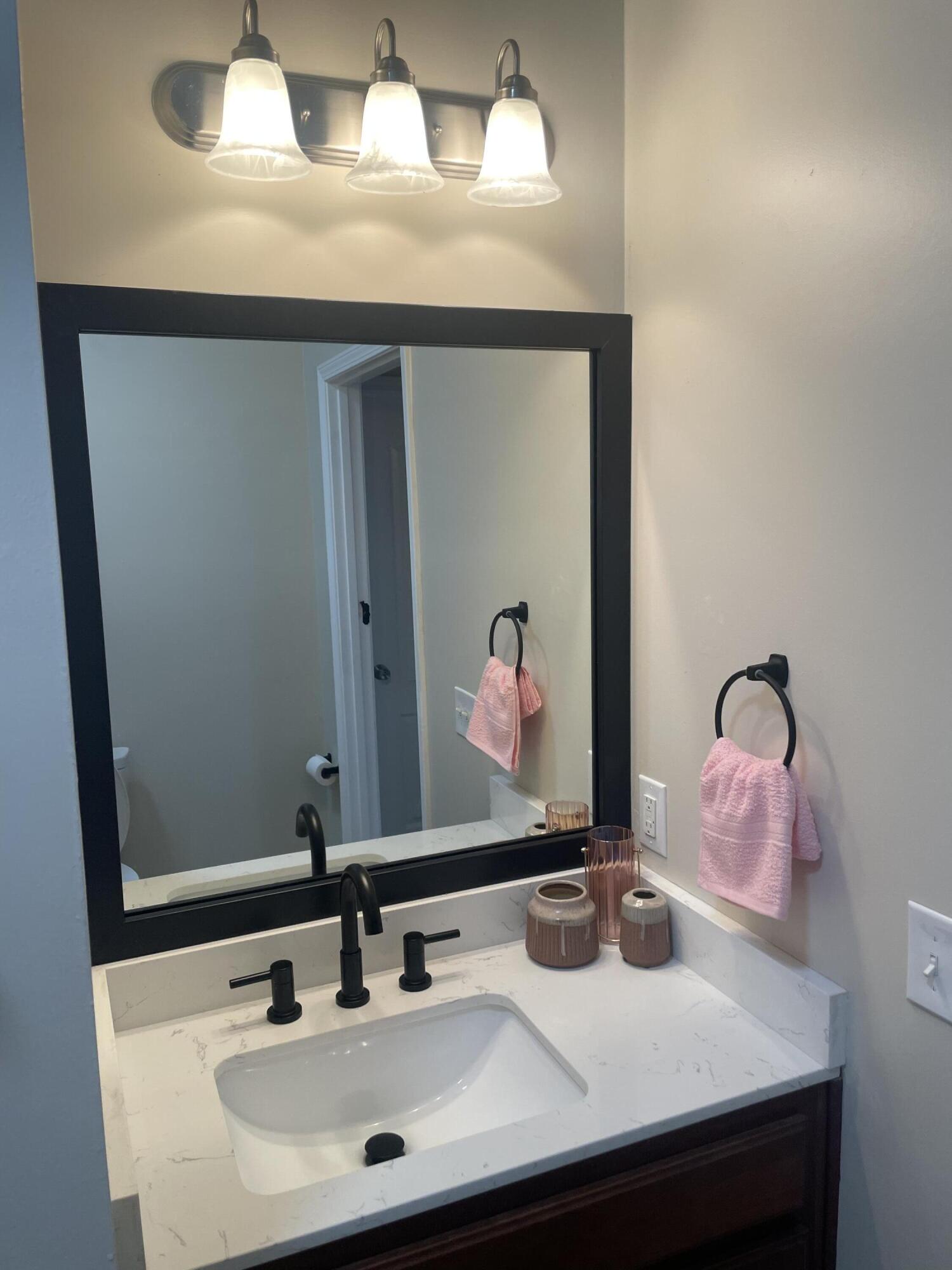 61 Mallot Beach Drive Freeport, FL 32439 - Photo 19 of 19 a bathroom with a sink and a mirror