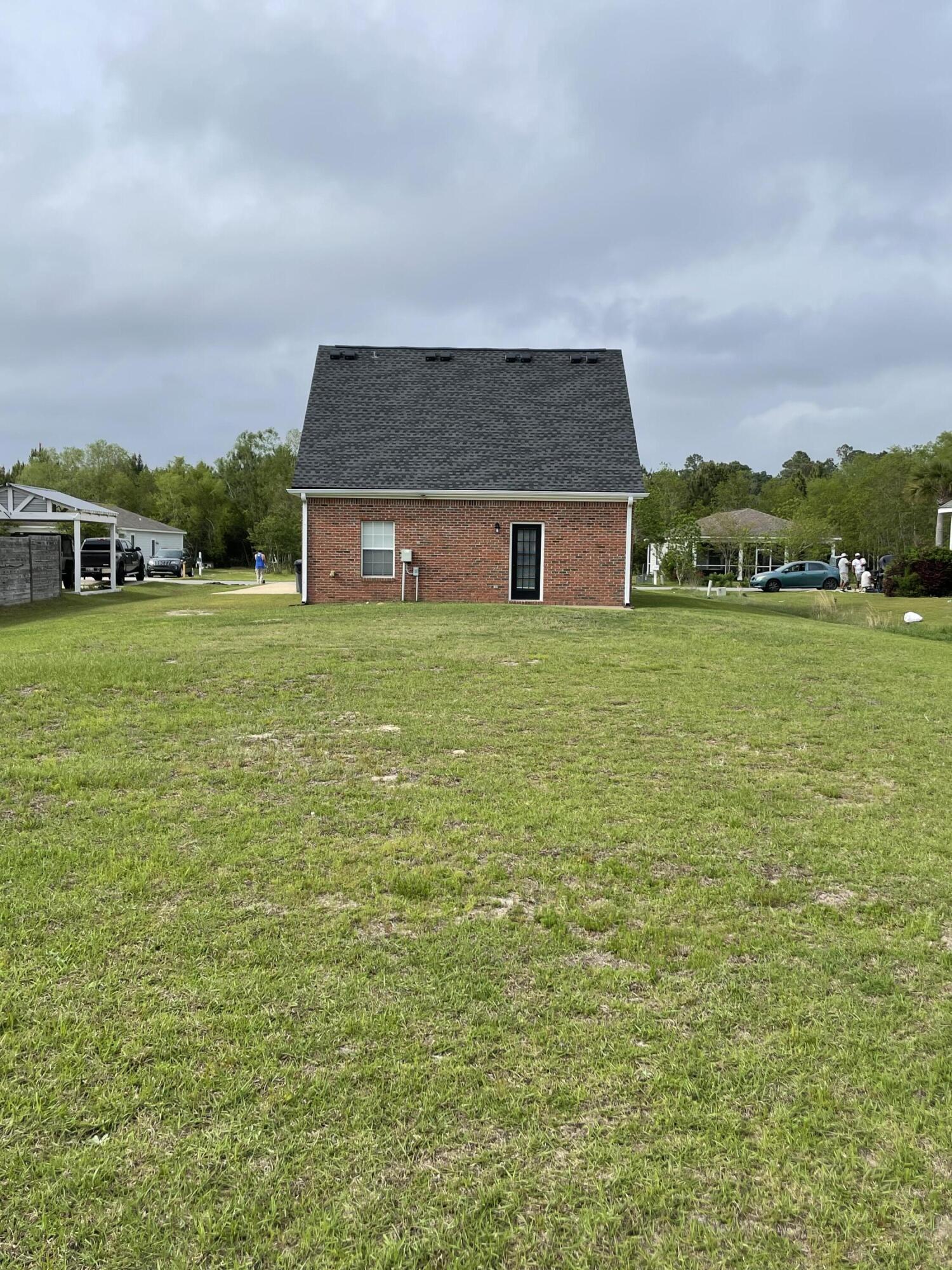 61 Mallot Beach Drive Freeport, FL 32439 - Photo 9 of 19 a house view with a garden space