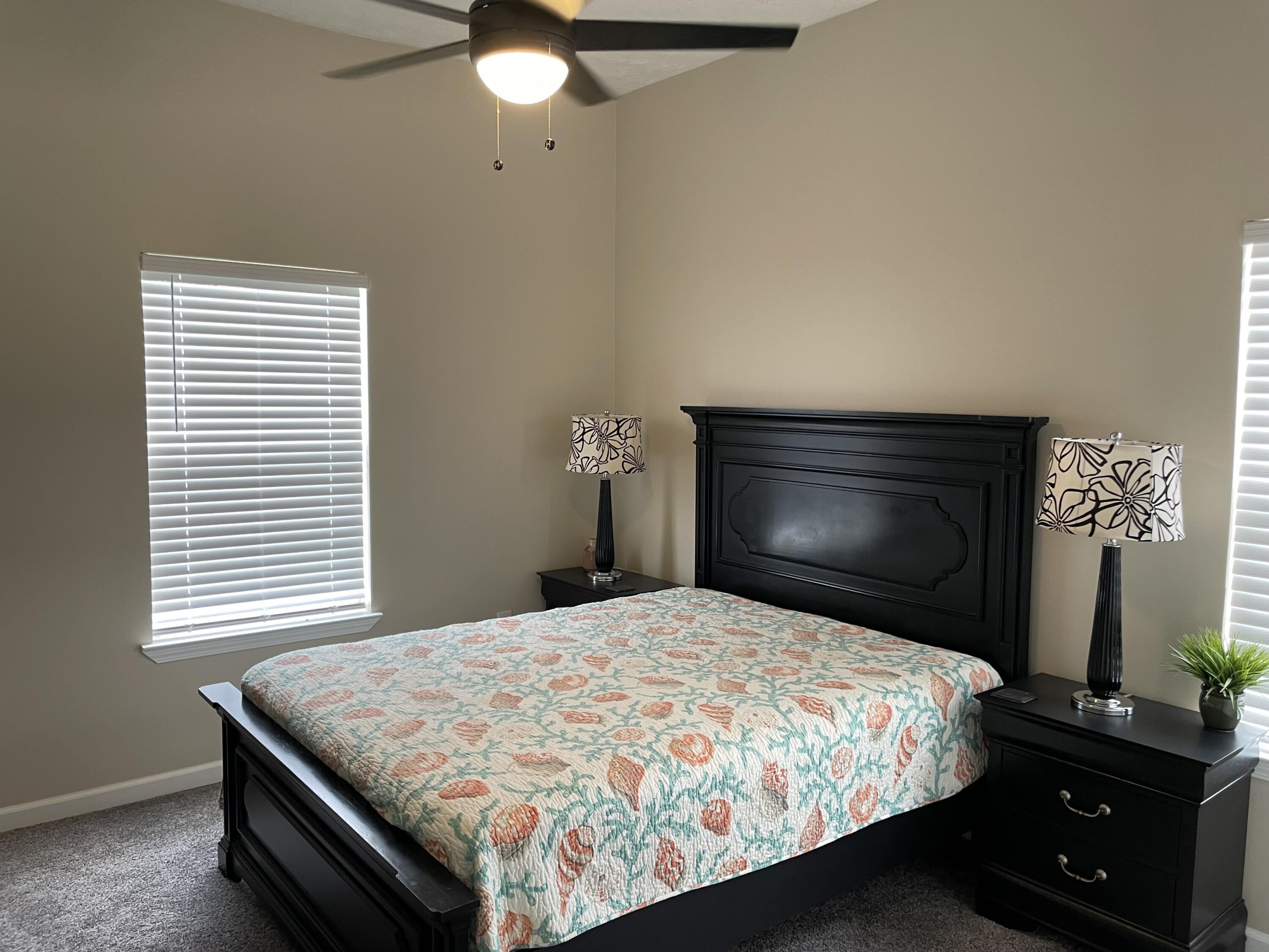 61 Mallot Beach Drive Freeport, FL 32439 - Photo 10 of 19 a bedroom with a bed and a fireplace