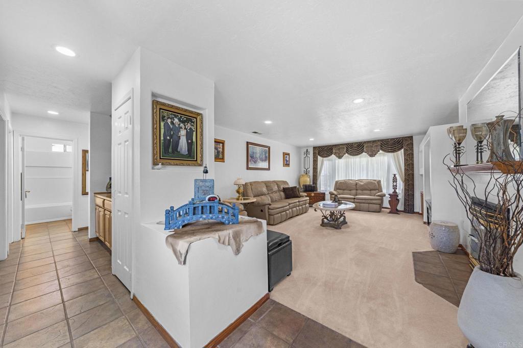 30265 Miller Road Valley Center, CA 92082 - Photo 19 of 56 a living room with furniture and a flat screen tv