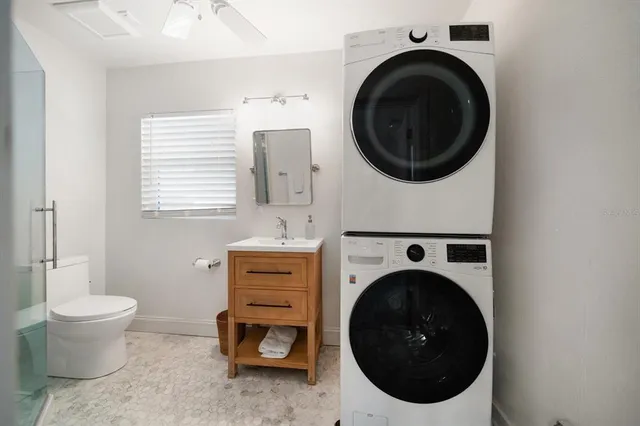 a utility room with dryer and washer