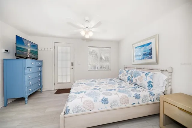 a bedroom with a bed and a dresser