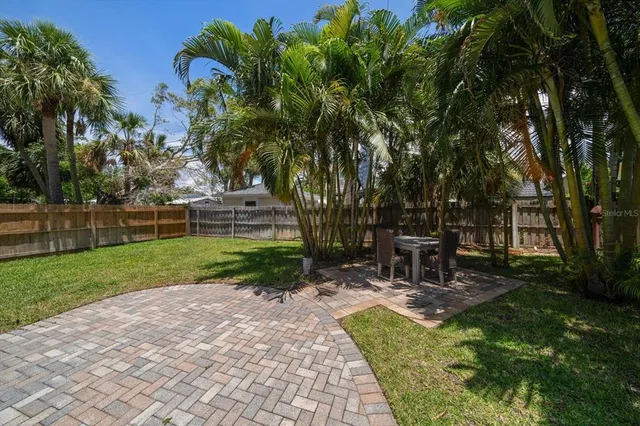 a view of a table and chairs in the garden