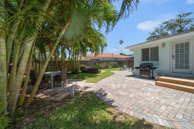 a view of yard with patio