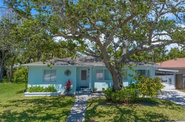 an aerial view of a house with a lake view