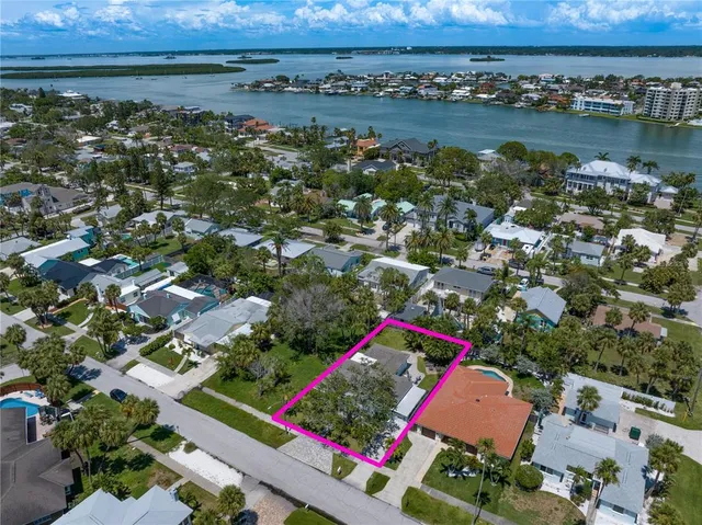 an aerial view of residential building and lake