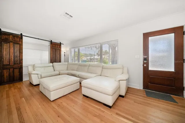 a living room with furniture and a window