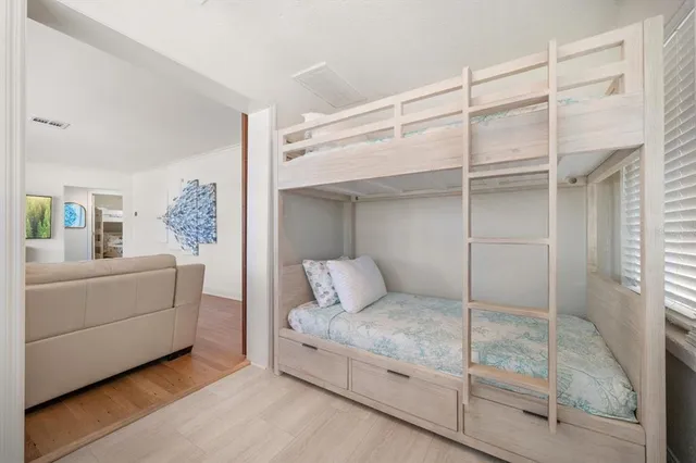 a room with a bed and a mirror