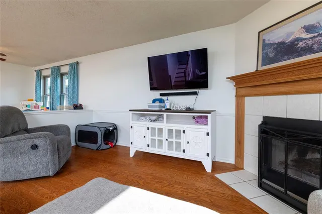 a bedroom with furniture and a fireplace