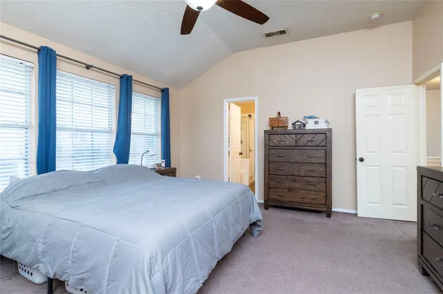 a bedroom with a bed and a closet